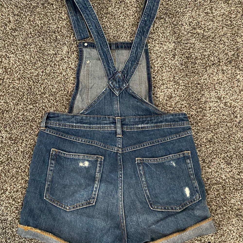 Denim ripped short overalls.